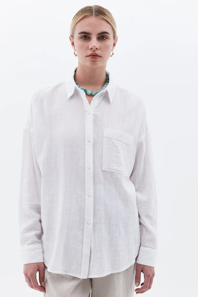 Women's cotton long sleeve shirt with a breast pocket.