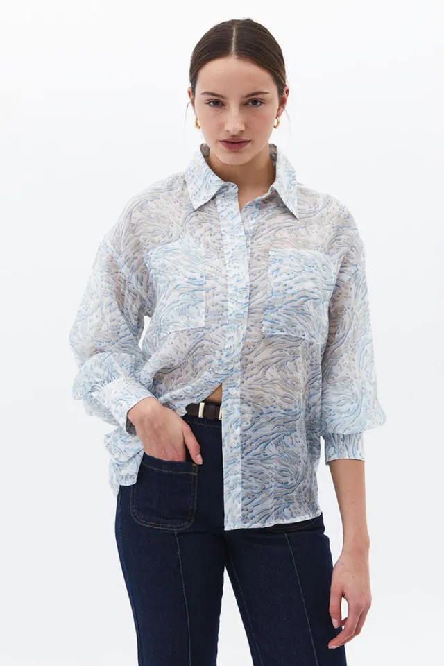 Women's long sleeve polyester shirt with a patterned chest pocket.